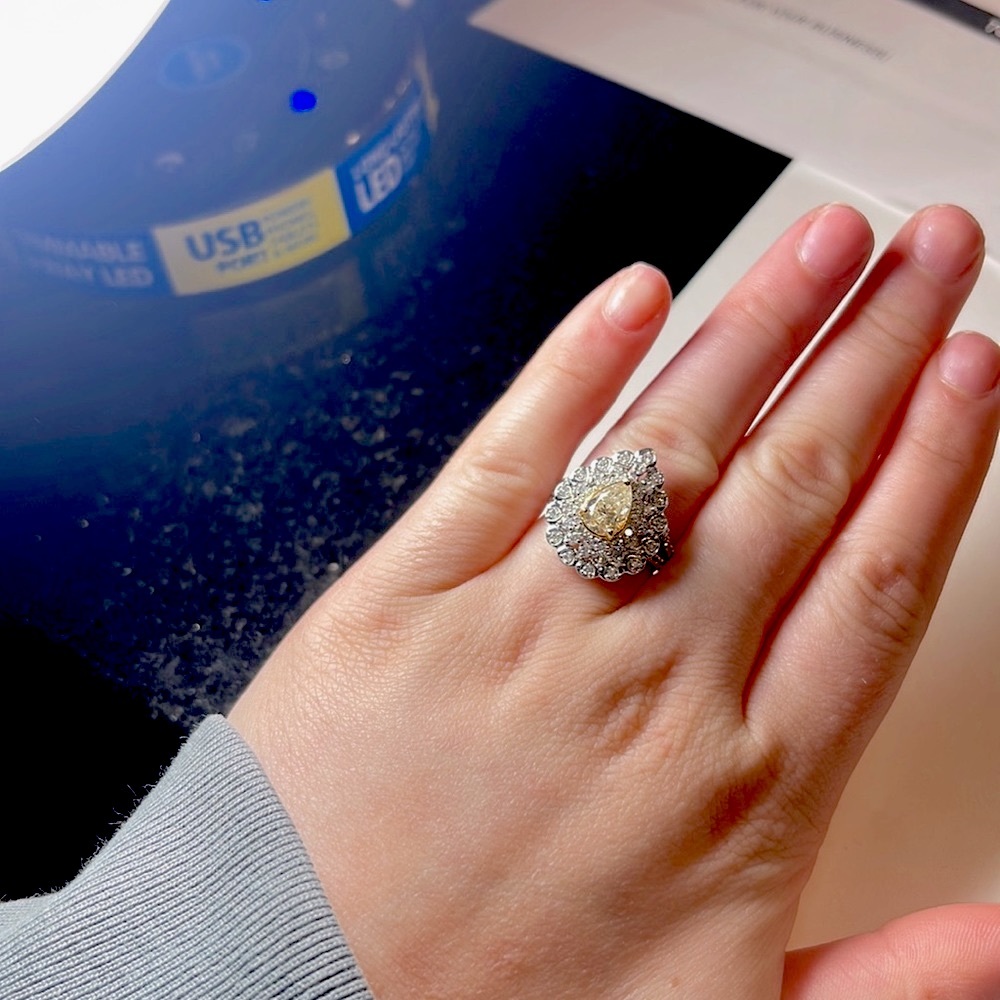18k two tone diamond ring set with a fancy light yellow center. Size 8